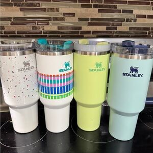 4 Stanley cups 1 brumate cup